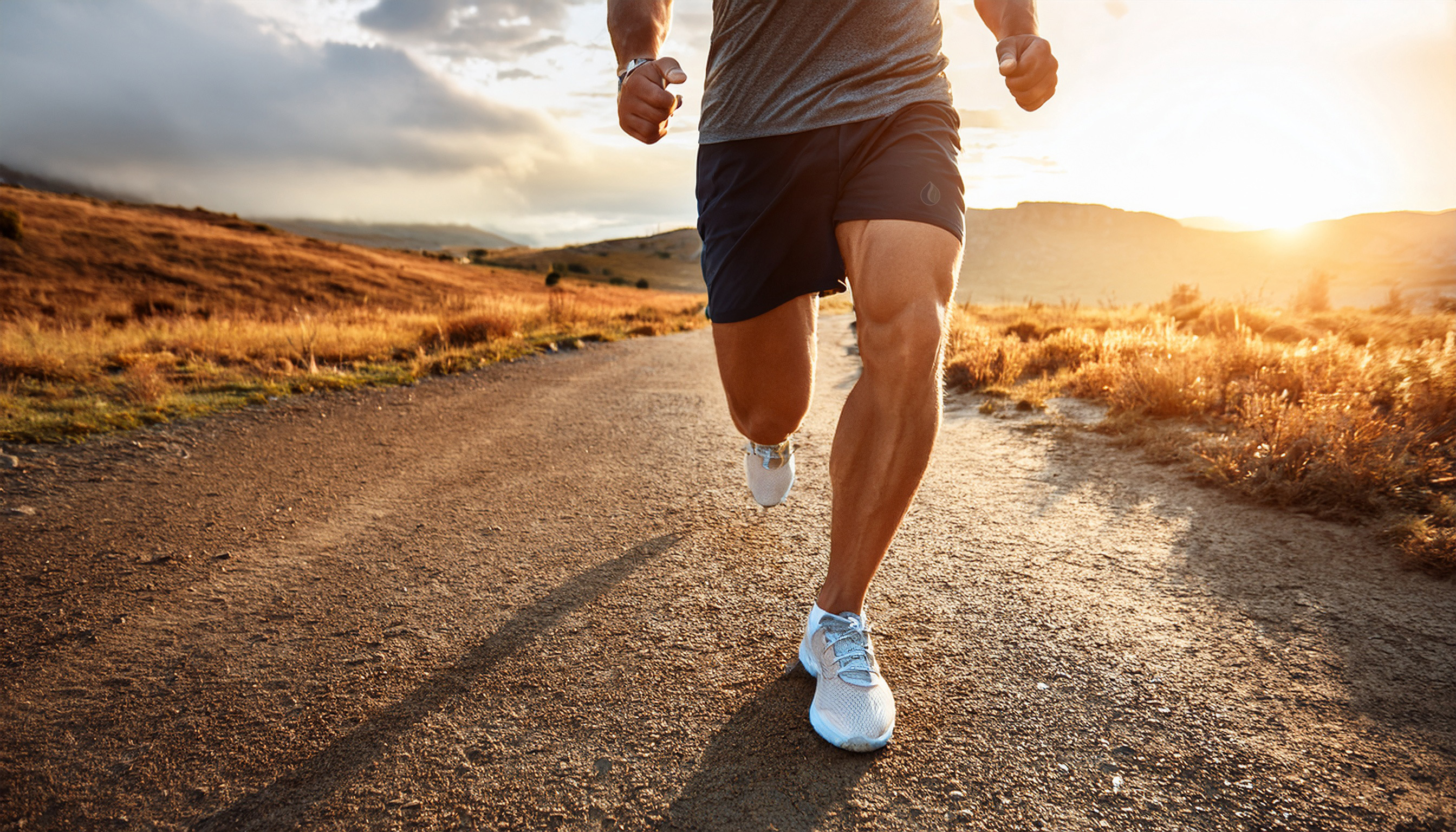 Runner on a sunny country road in nature, symbolizing sports, endurance, and muscle recovery with magnesium